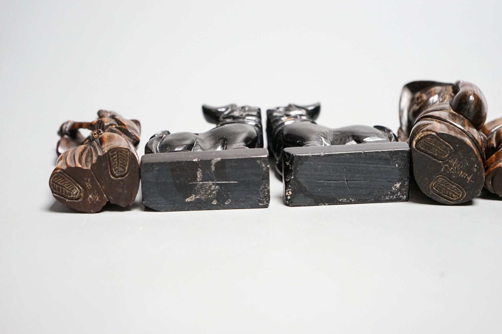 A quantity of hardwood netsuke and other carvings, signed